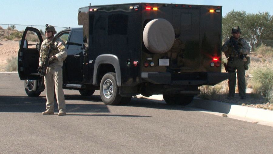 Security officers protect big rigs hauling nuclear weapons.  Photograph: Office of Secure Transportation.